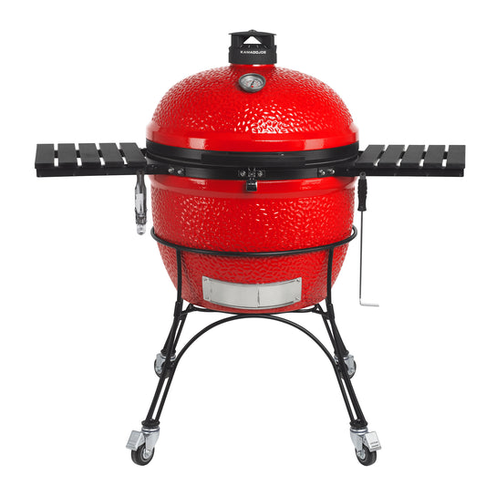 Kamado Joe Big Joe II sobre carrito metálico con estantes laterales desplegados, vista frontal
